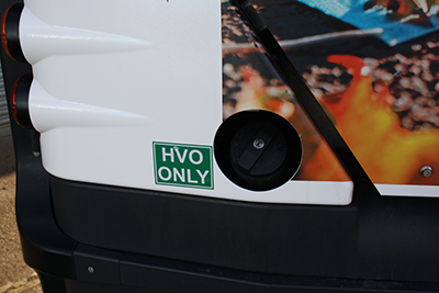 Image of a fuel cap with a HVO Only sticker next to it