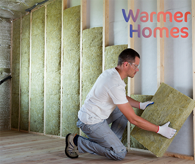 Image of person installing insulation