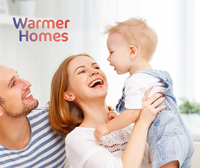 Photo of a couple with a small child and text "warmer homes"