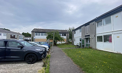 Cars parked outside flats