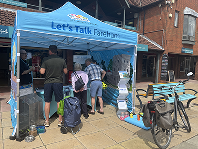 Photo of the Lets Talk Fareham Gazebo, with people underneath talking to council officers