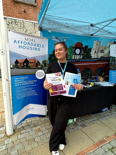 Engagement staff holding flyers