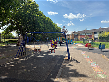 Crossfell Walk play area showing colour play equipment in the park