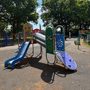Crossfell Walk play area showing colour play equipment in the park