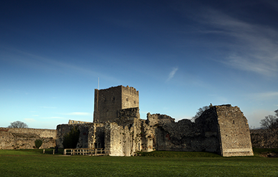 Portchester Castle with bright blue sky