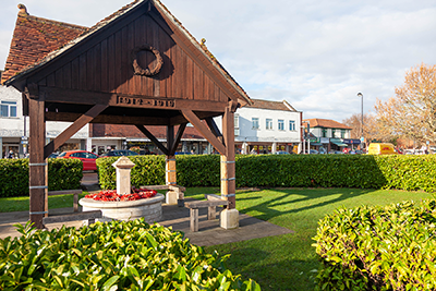 Stubbington village pump, under wooden shelter in a park 