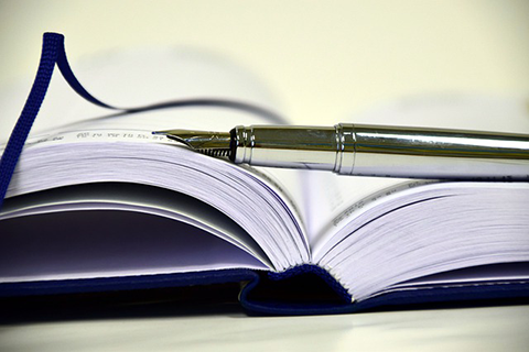 Image of open diary and pen