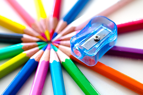 Image of brightly coloured pencils arranged in a circle