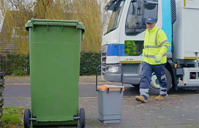 Photo of a bin man collecting general waste and food waste