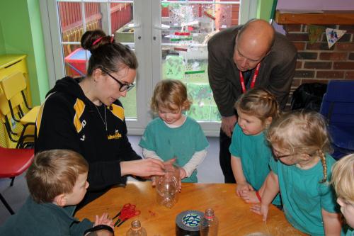 L to R: James, Nathalie, Ella, Cllr Martin, Mackenzie, Mila and Beth learning how to make plant pots out of plastic bottles