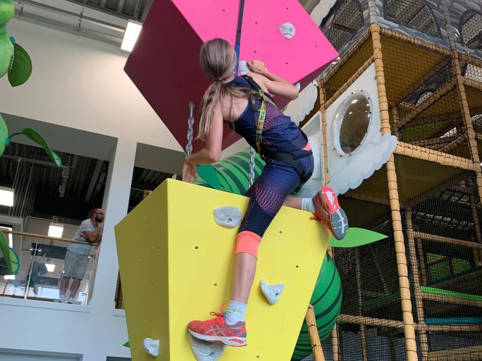 Photo of child climbing up blocks