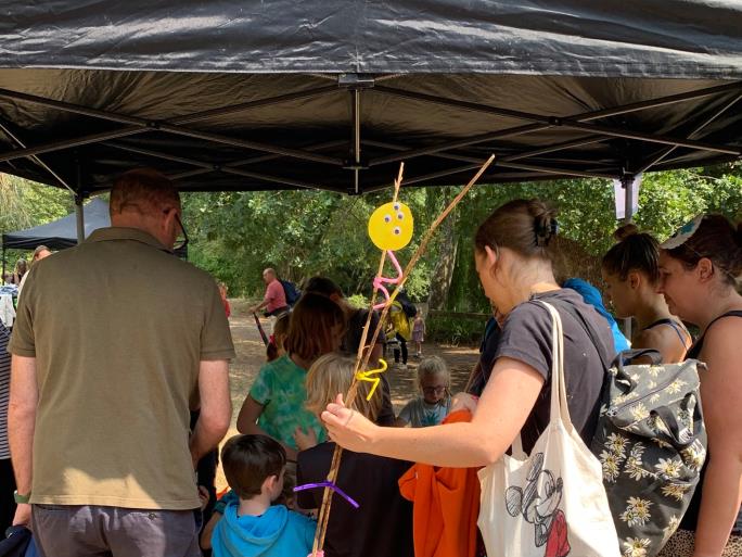 Photo of families under a gazebo