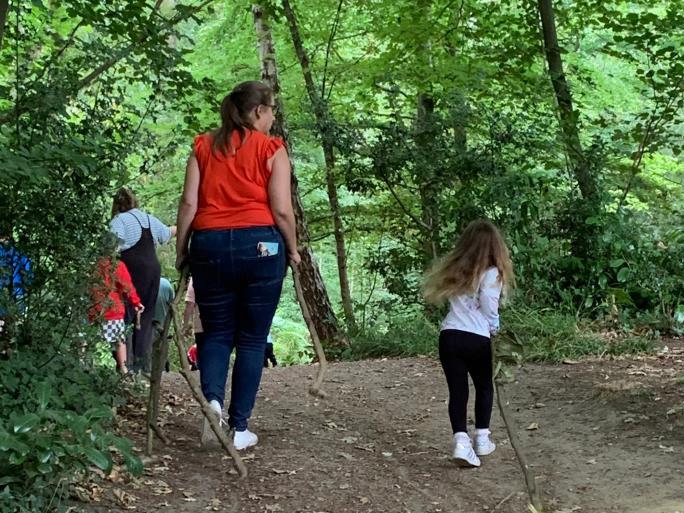 Photo of family walking path through the woods