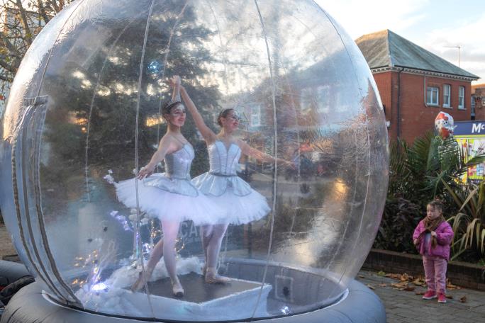 Ballerinas inside a globe