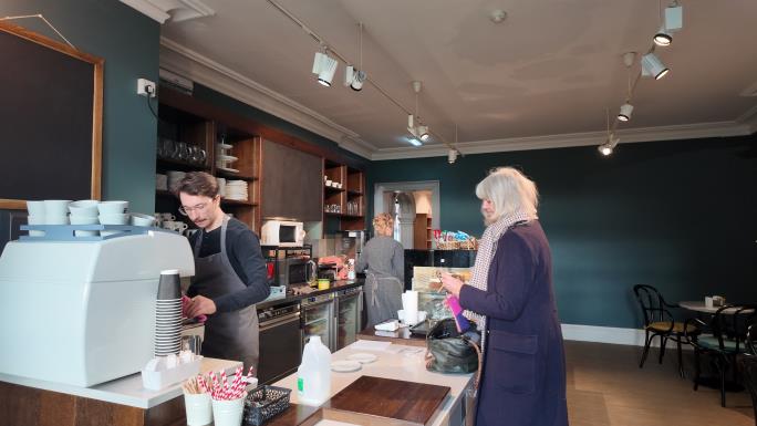 Westbury Manor café serving customer