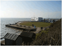 a view of beach huts and sea