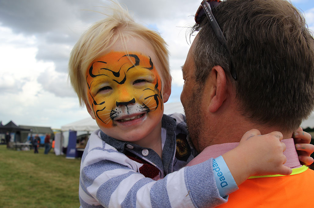 Boy with tiger face paint