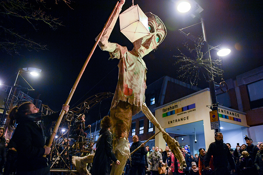 Giant Lantern being passed to Winter Giant