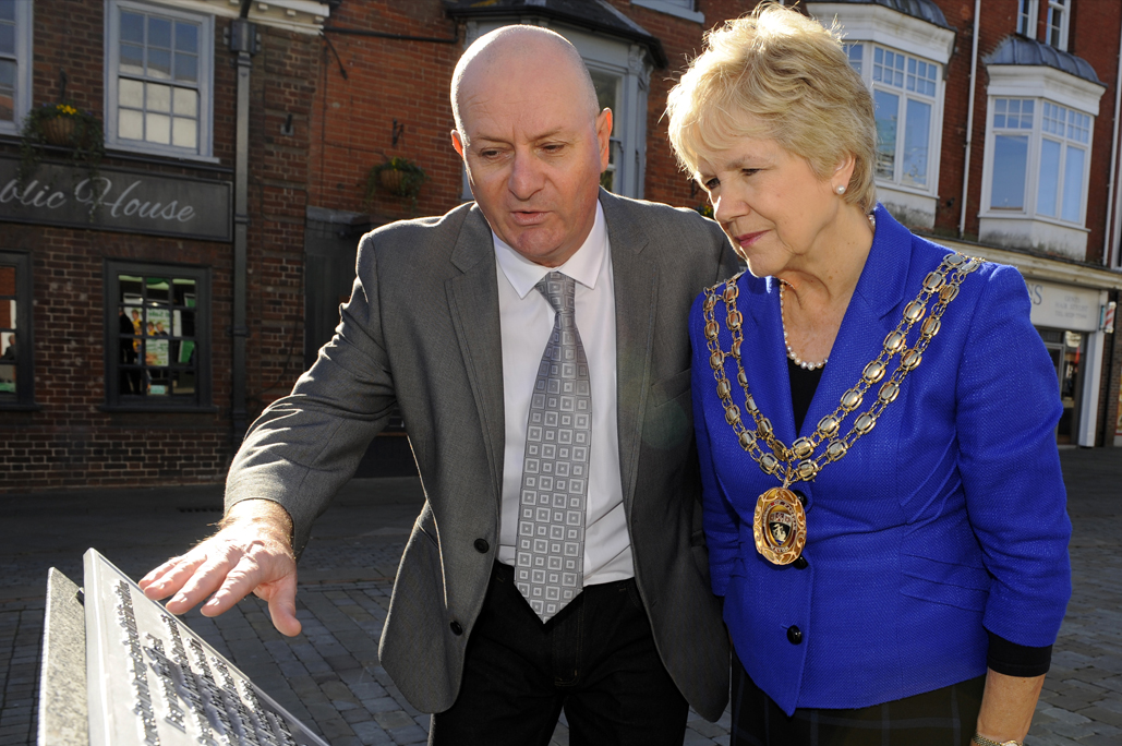 Mayor looking at memorial