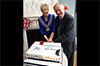 Thumbnail of Mayor cutting cake