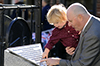 Thumbnail of Person looking at new memorial