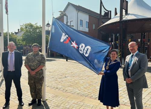 Raising a flag for VJ Day